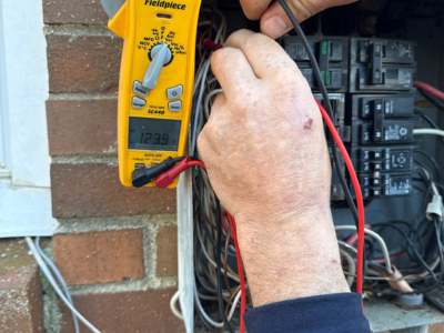 Professional Electrician working on Electrical Panel