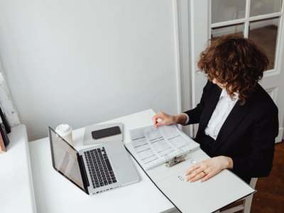 Heat pump unit mounted on exterior wall of residential building.